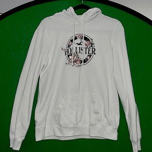 A white Hollister hooded sweatshirt in a size large. (Runs small)